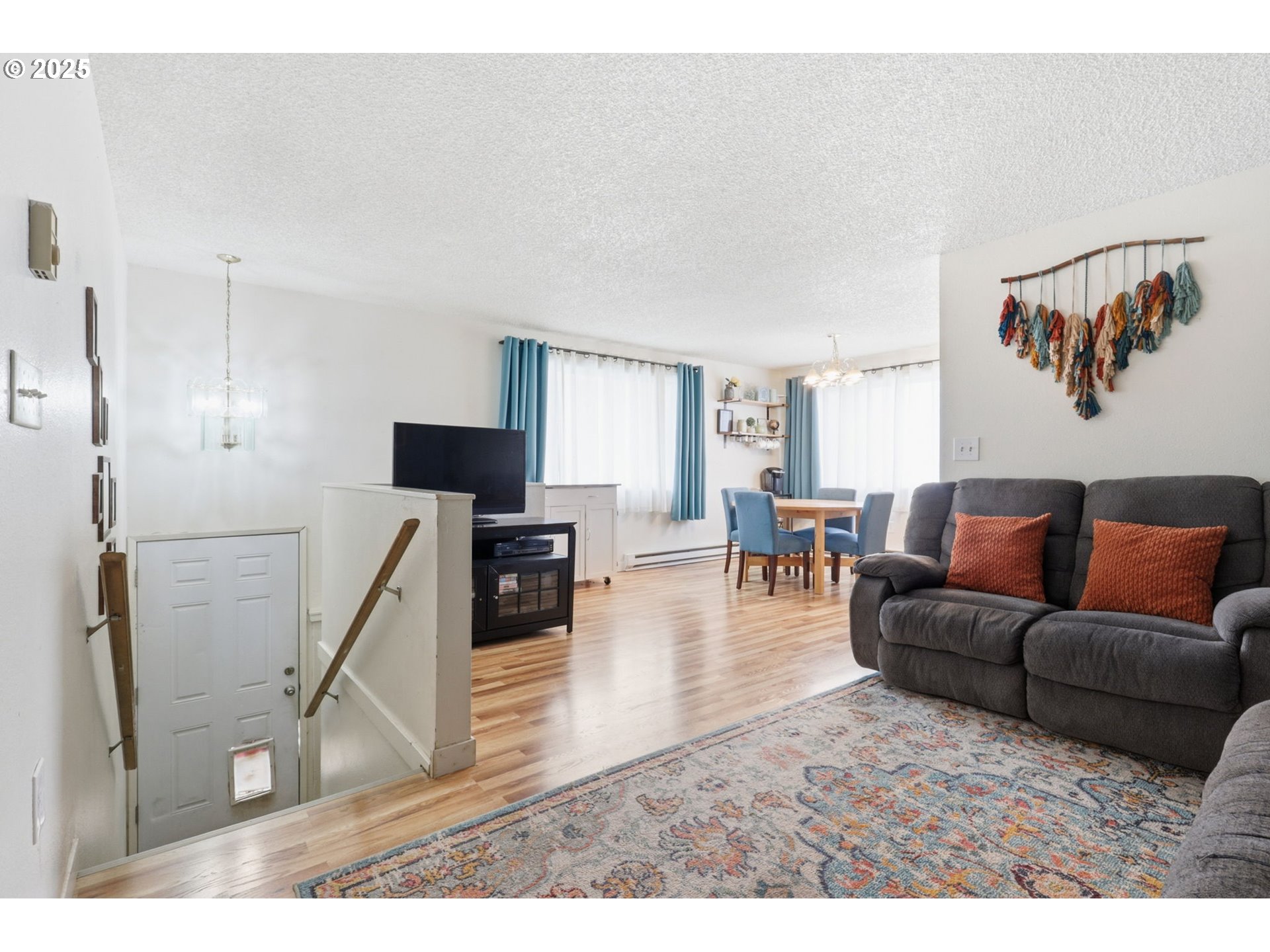 1123 Northwest Ash Street Camas, WA 98607 - Photo 2 of 26 a living room with furniture and a flat screen tv