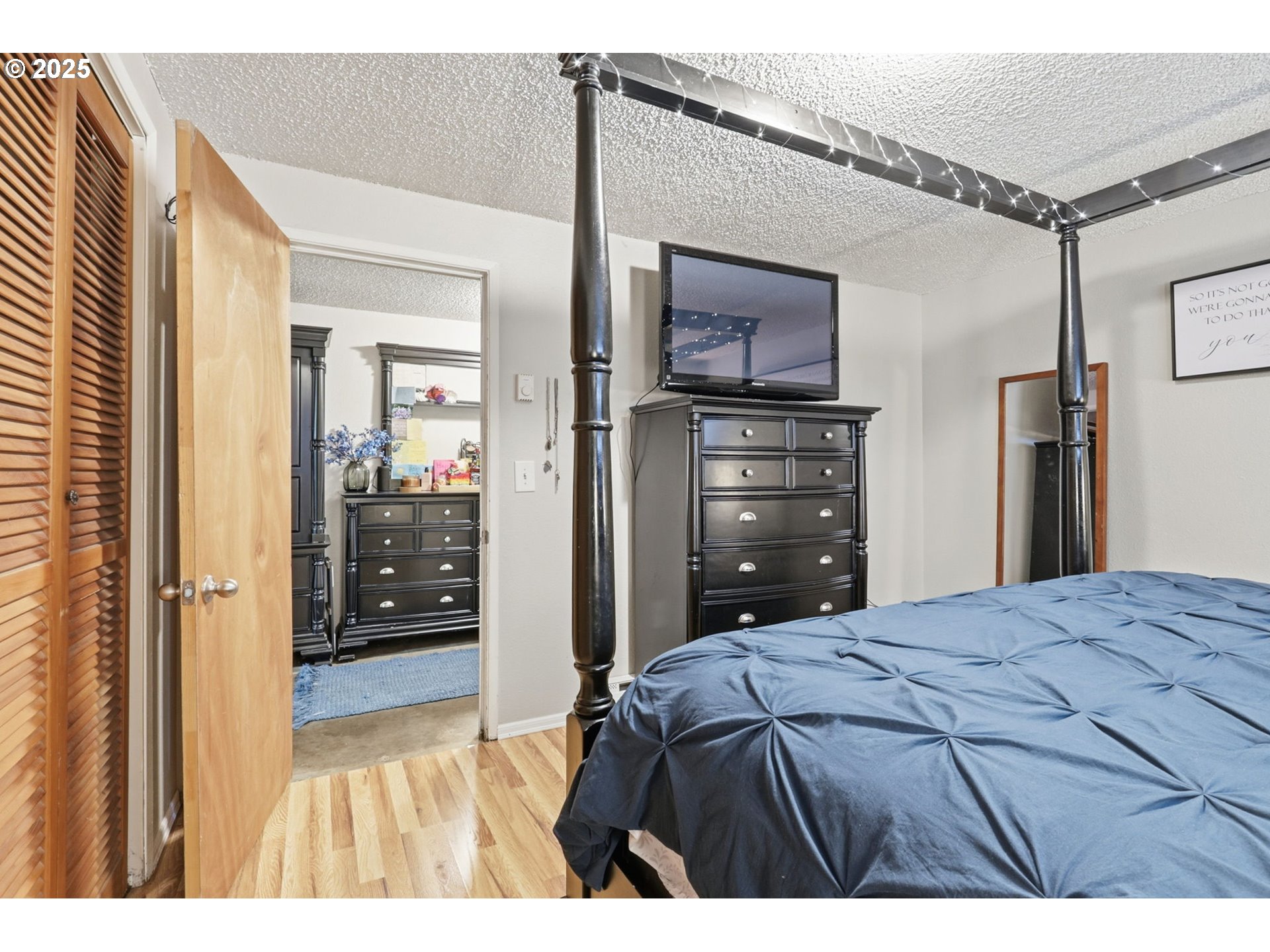 1123 Northwest Ash Street Camas, WA 98607 - Photo 21 of 26 a bedroom with a bed and a television