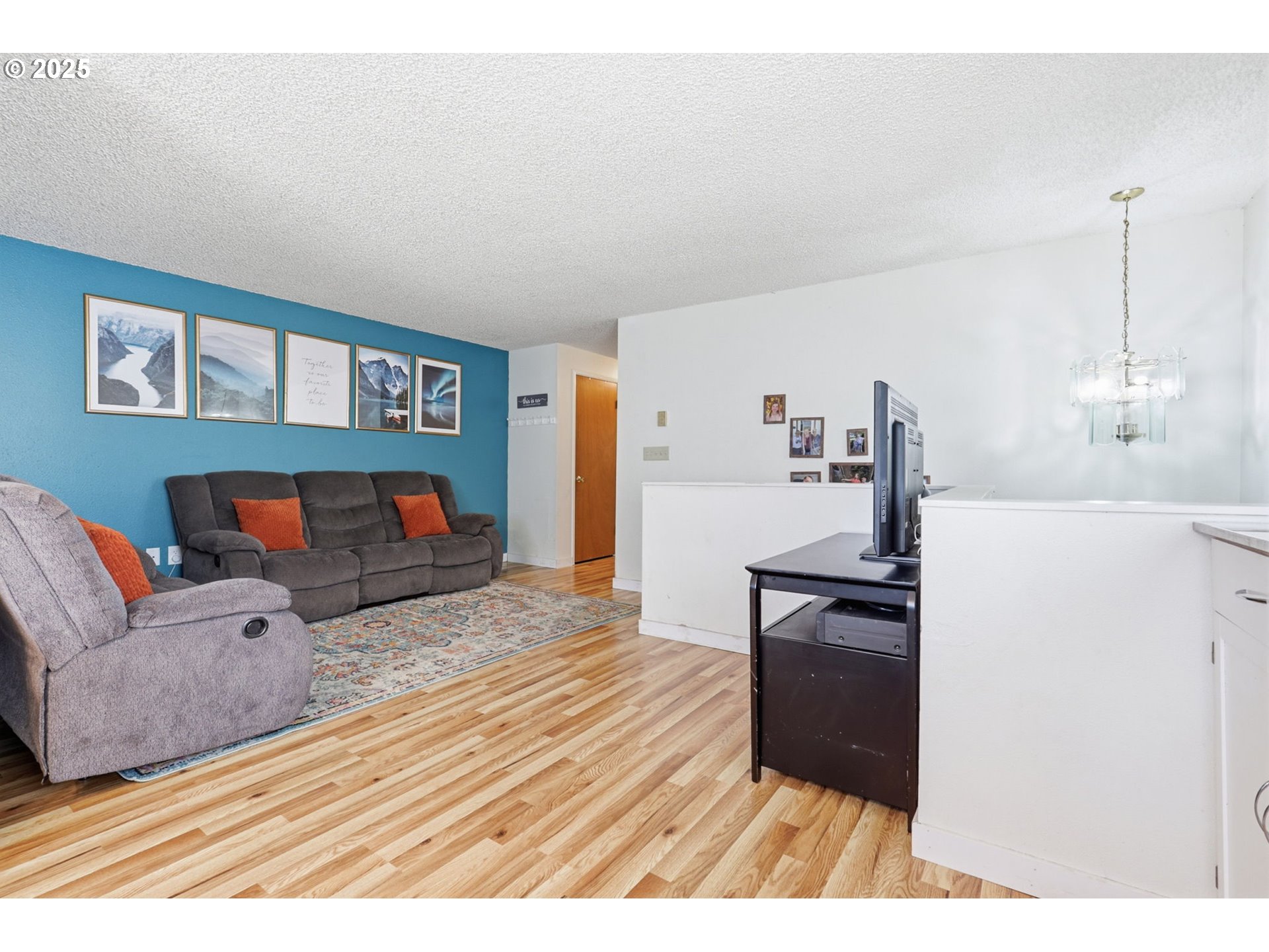 1123 Northwest Ash Street Camas, WA 98607 - Photo 5 of 26 a living room with furniture and a wooden floor
