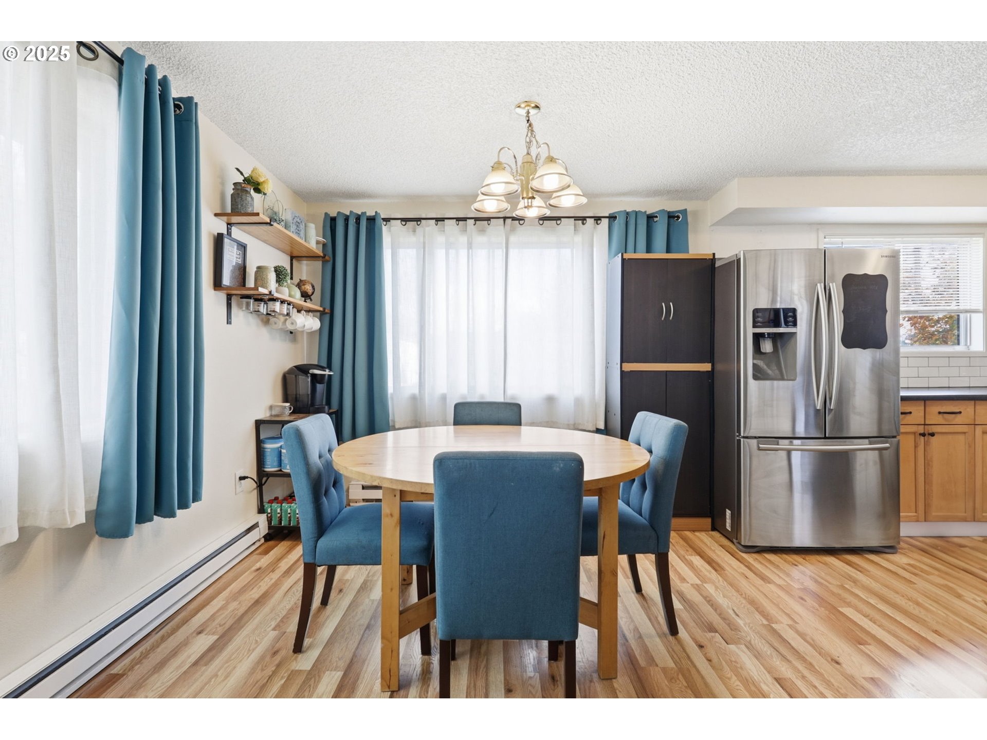 1123 Northwest Ash Street Camas, WA 98607 - Photo 7 of 26 a view of a dining room with furniture window and wooden floor