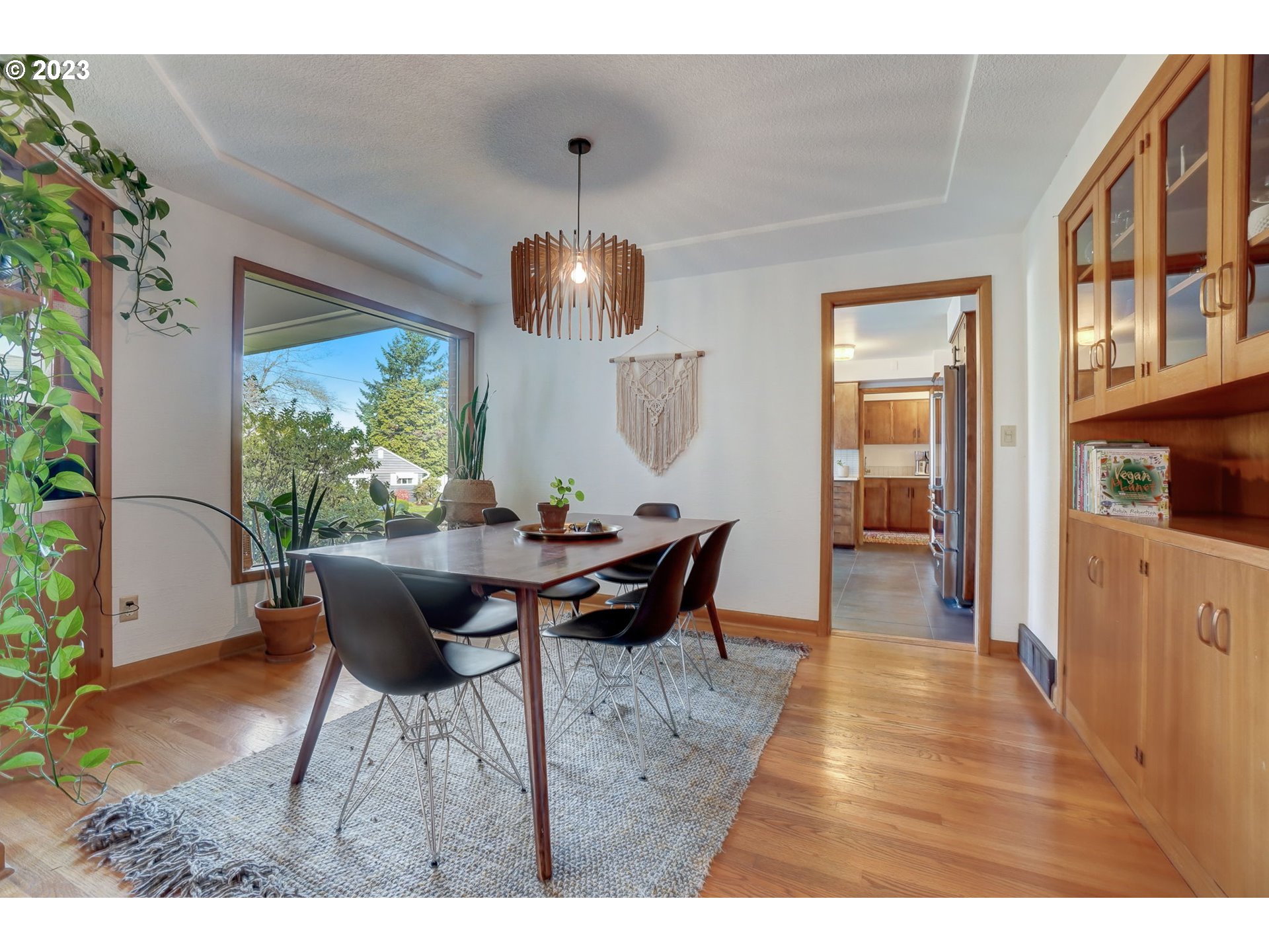4020 Northeast Rosa Parks Way Portland, OR 97211 - Photo 11 of 48 a view of a dining room with furniture window and wooden floor