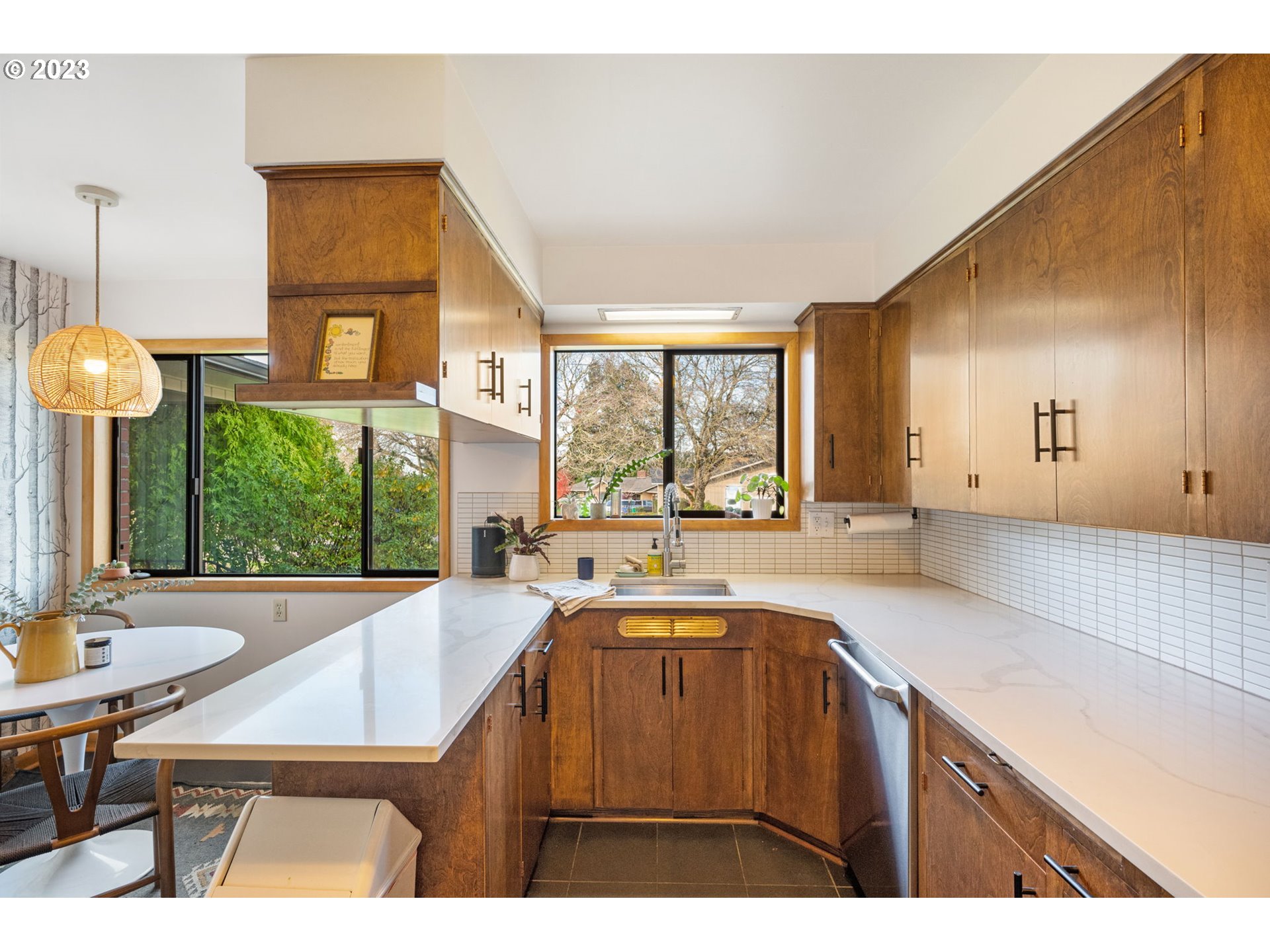 4020 Northeast Rosa Parks Way Portland, OR 97211 - Photo 15 of 48 a kitchen with a sink a counter top space and living room view