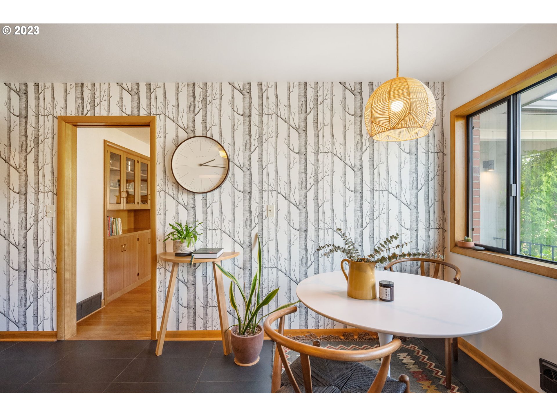 4020 Northeast Rosa Parks Way Portland, OR 97211 - Photo 17 of 48 a view of a dining room with furniture and wooden floor