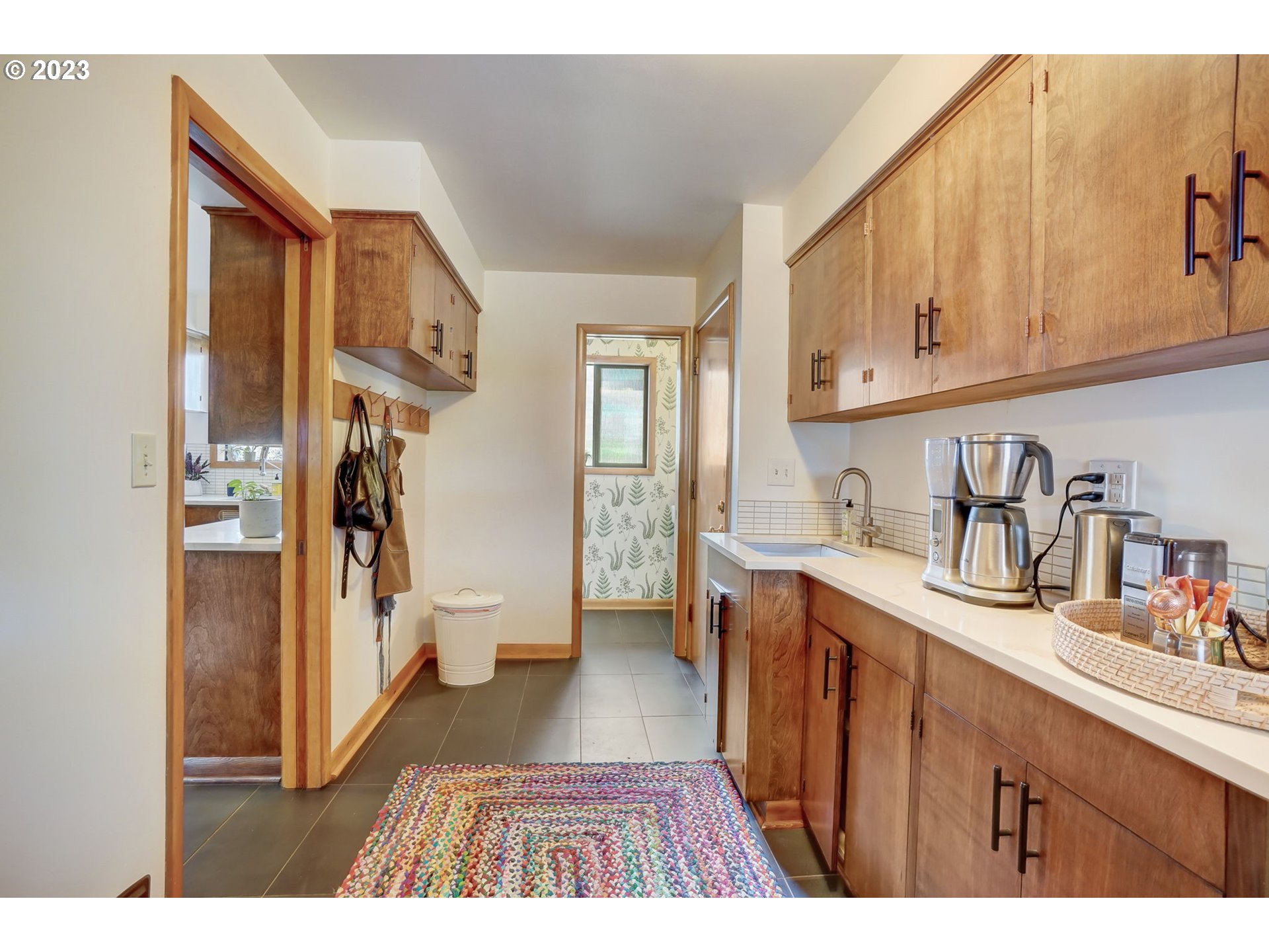 4020 Northeast Rosa Parks Way Portland, OR 97211 - Photo 18 of 48 a open kitchen with cabinets a sink and a refrigerator