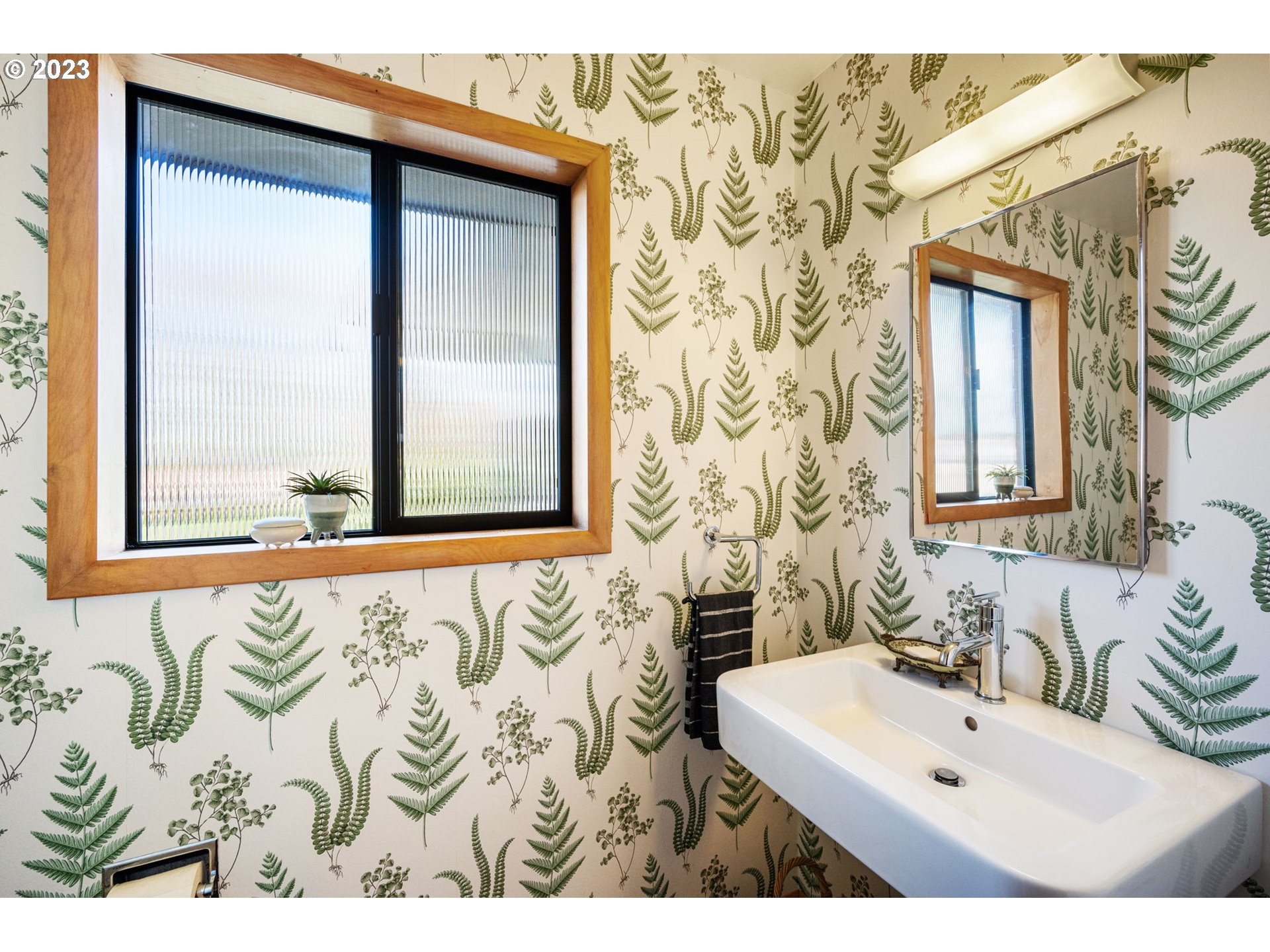 4020 Northeast Rosa Parks Way Portland, OR 97211 - Photo 19 of 48 a bathroom with a sink and a mirror