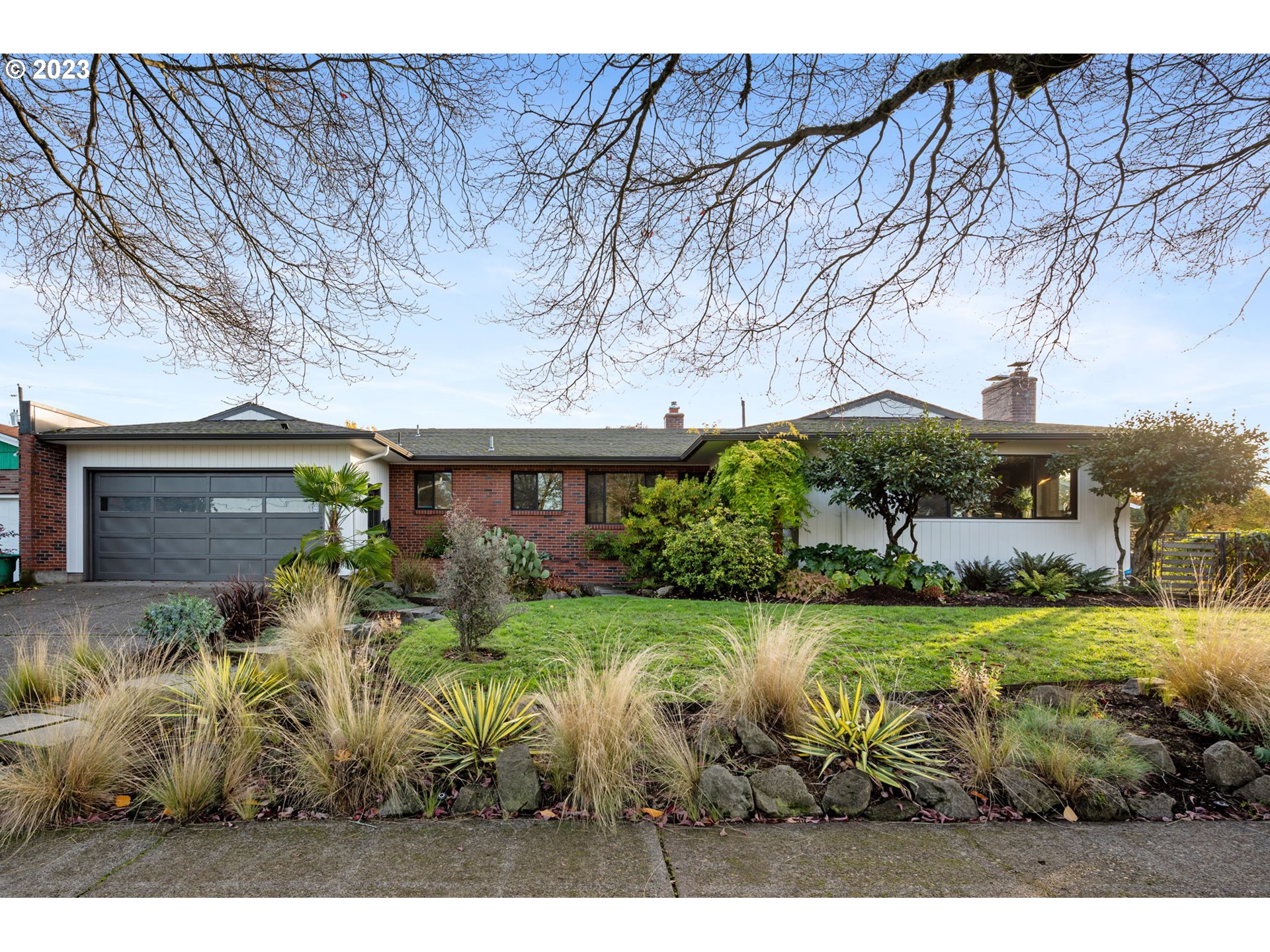 4020 Northeast Rosa Parks Way Portland, OR 97211 - Photo 2 of 48 a view of a house with a garden