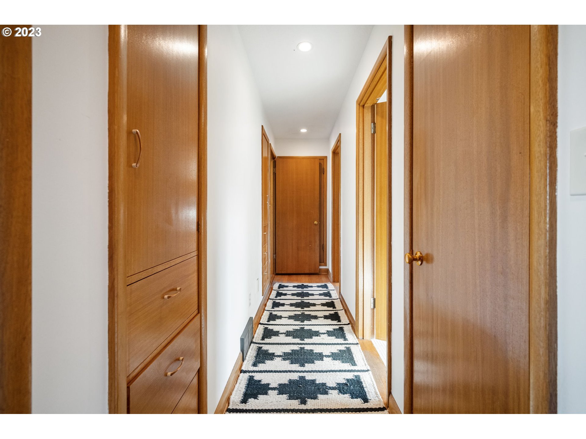 4020 Northeast Rosa Parks Way Portland, OR 97211 - Photo 21 of 48 a view of a hallway with wooden floor and staircase
