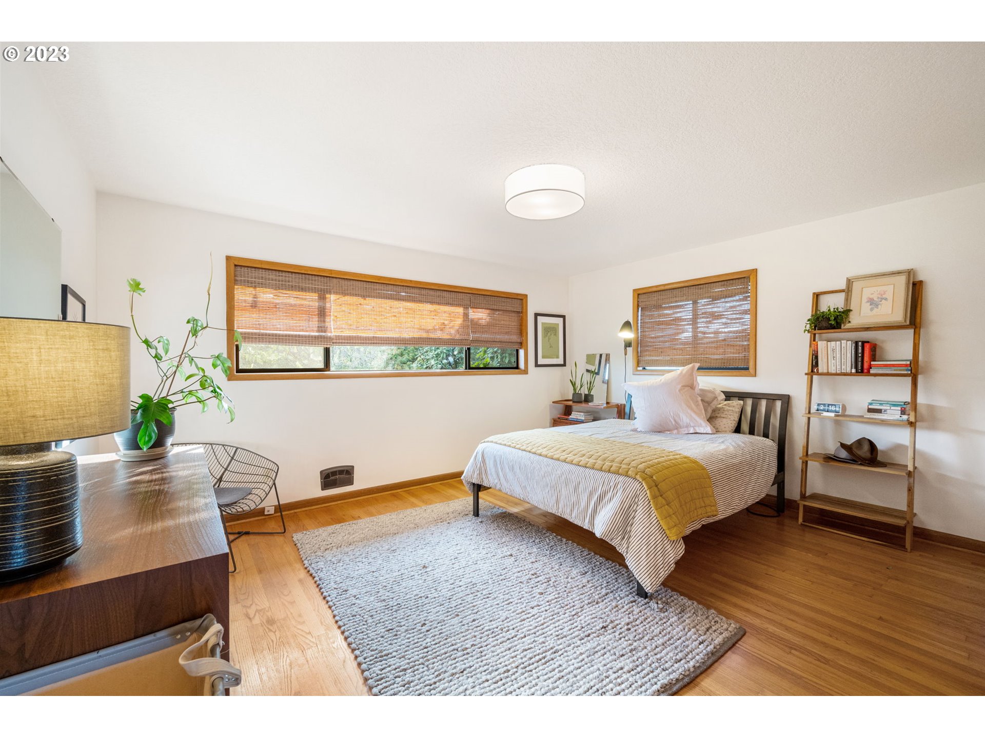 4020 Northeast Rosa Parks Way Portland, OR 97211 - Photo 22 of 48 a bedroom with a bed window and table