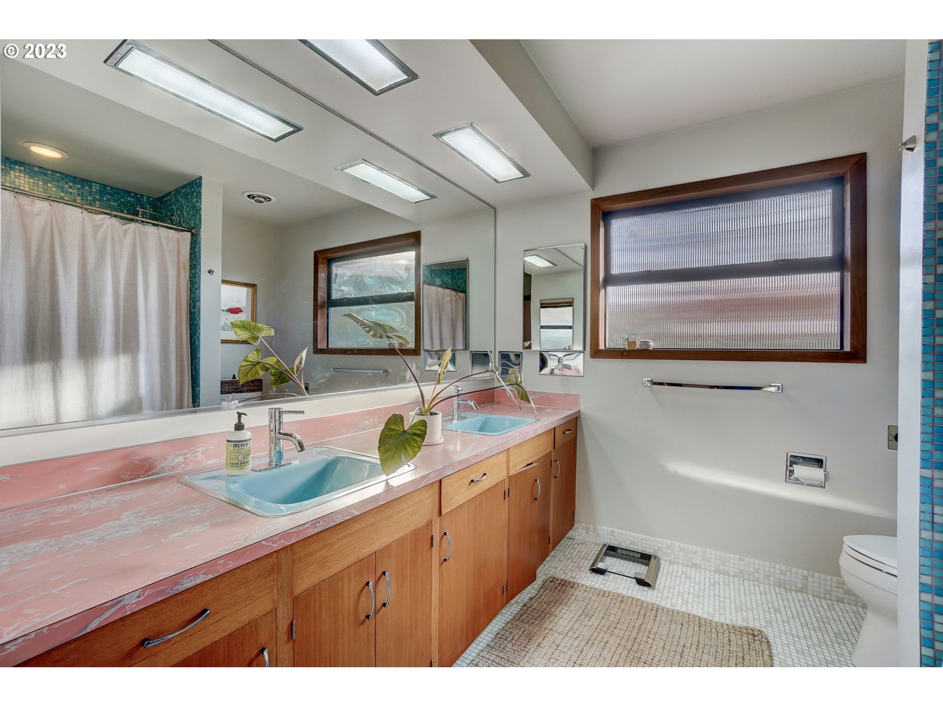4020 Northeast Rosa Parks Way Portland, OR 97211 - Photo 27 of 48 a bathroom with a granite countertop sink mirror and bathtub