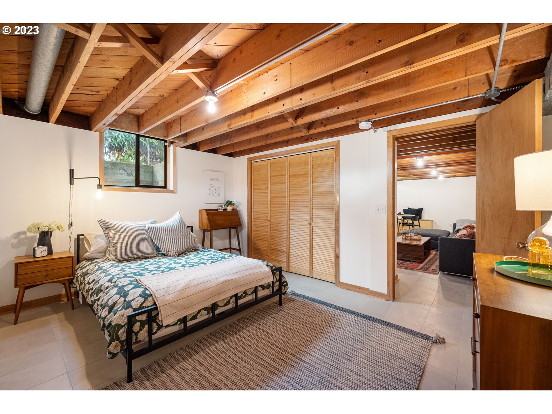 4020 Northeast Rosa Parks Way Portland, OR 97211 - Photo 32 of 48 a bedroom with a bed and a walk in closet