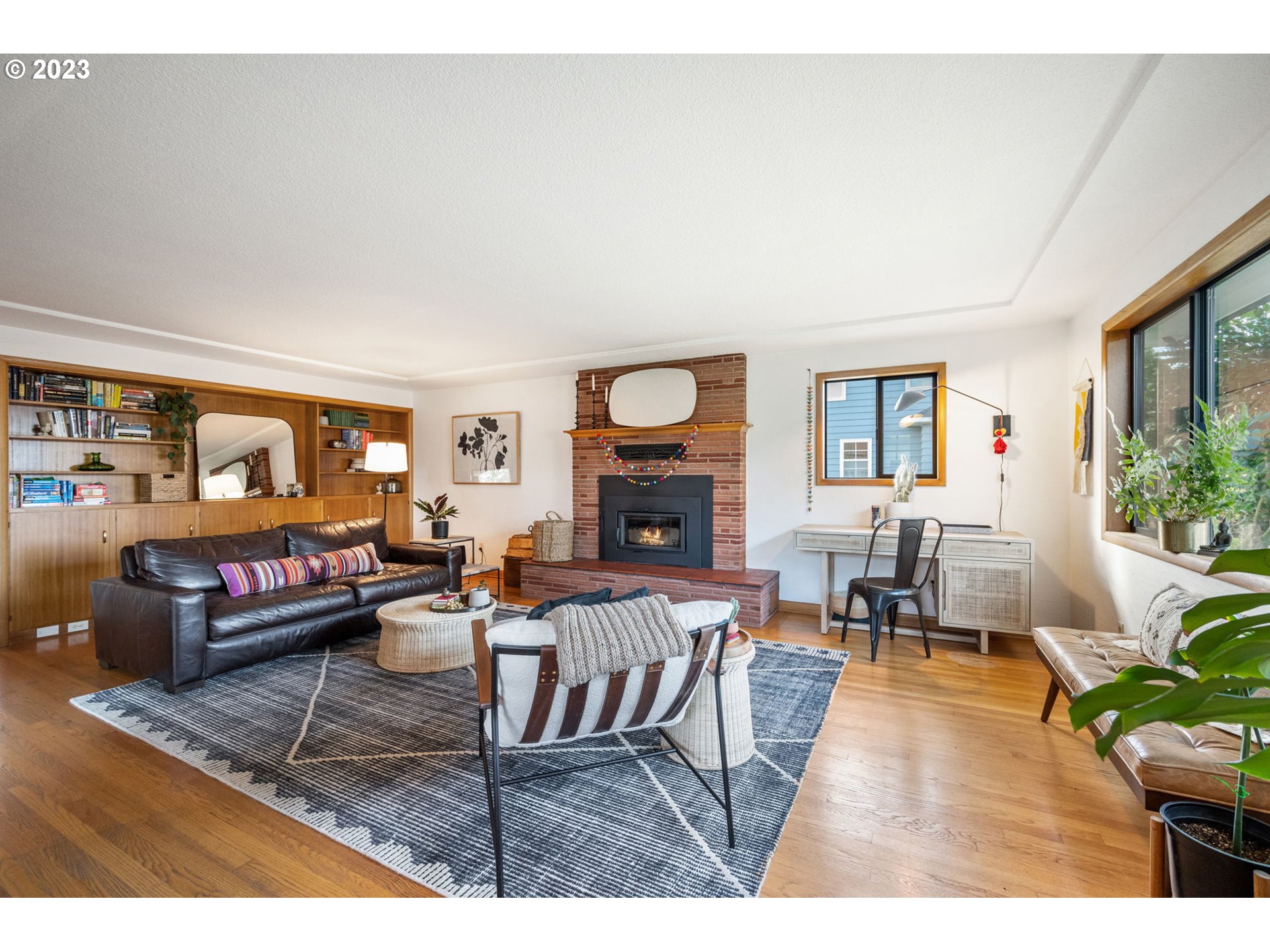 4020 Northeast Rosa Parks Way Portland, OR 97211 - Photo 5 of 48 a living room with fireplace furniture and a wooden floor
