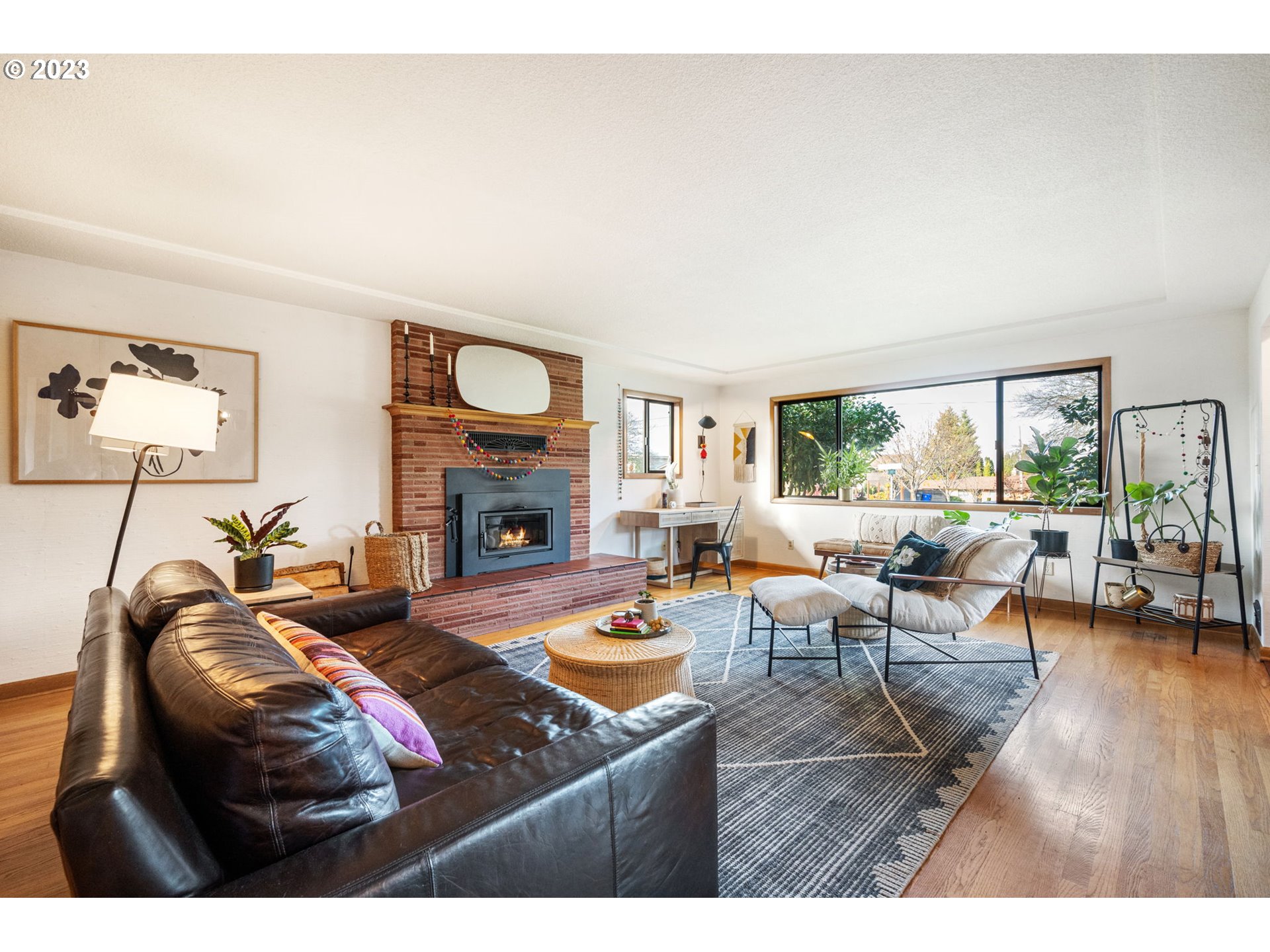 4020 Northeast Rosa Parks Way Portland, OR 97211 - Photo 7 of 48 a living room with furniture and a fireplace