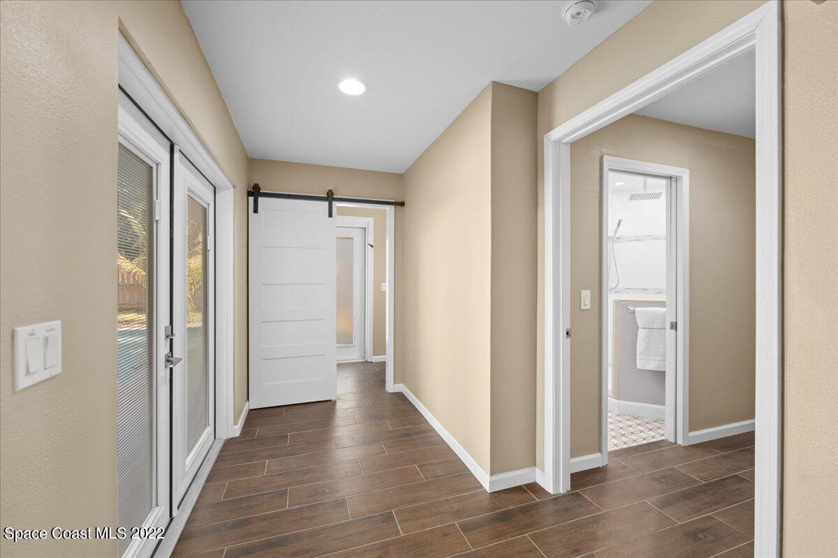 239 Sand Pine Road Indialantic, FL 32903 - Photo 44 of 74 Hallway to half bath