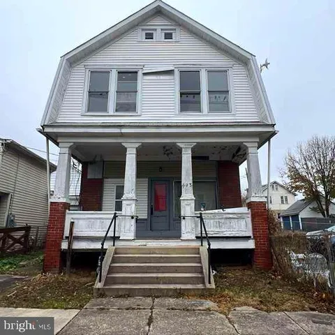 a front view of a house with a porch