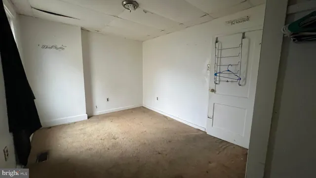 a room with gym equipment and a mirror