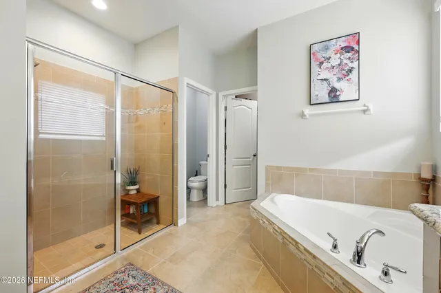 a bathroom with a tub and a shower