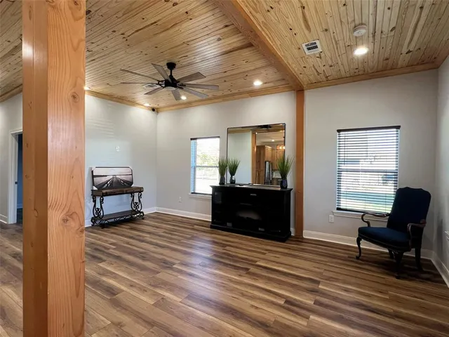 a view of a livingroom with furniture and wooden floor