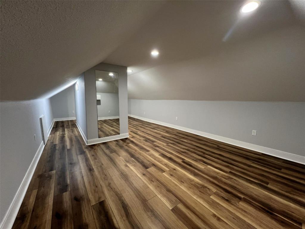 724 Franklin Street Bellevue, TX 76228 - Photo 28 of 32 a view of wooden floor
