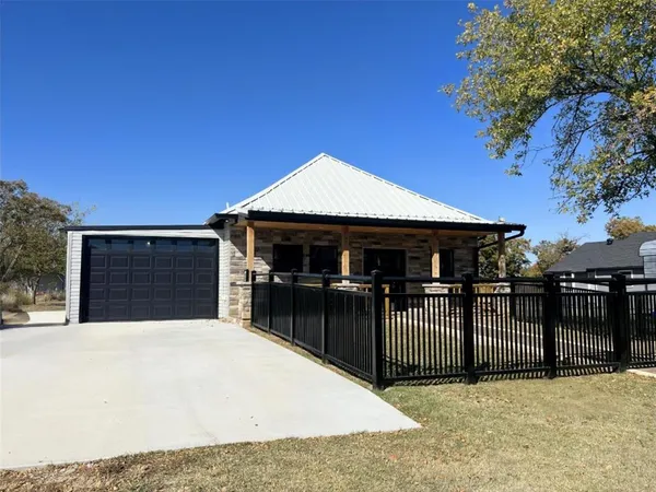 a front view of a house with a garage