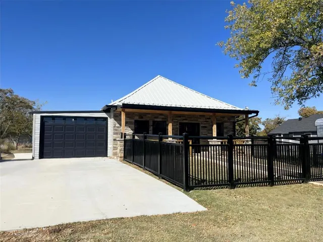 a front view of a house with a garage