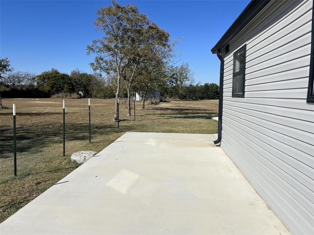 724 Franklin Street Bellevue, TX 76228 - Photo 5 of 32 a view of a backyard