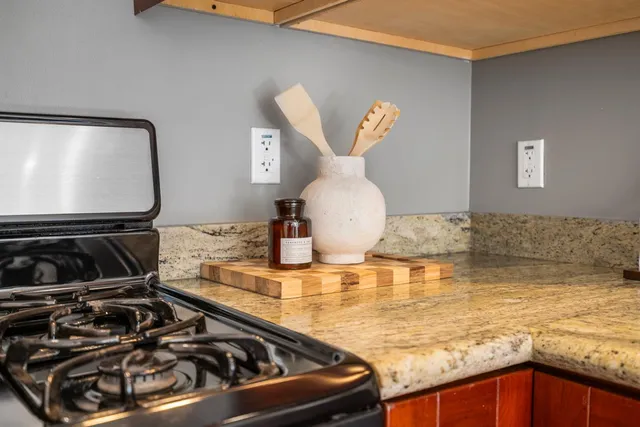 a kitchen with a stove and a microwave