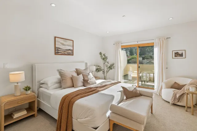 a bedroom with a bed and a couch