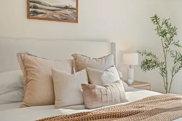 a bedroom with a bed and a couch
