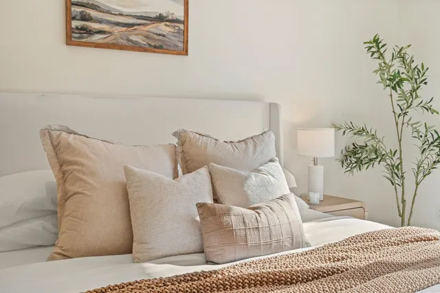 a bedroom with a bed and a couch