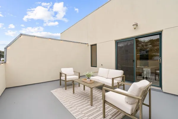 a view of a chairs and table in a terrace
