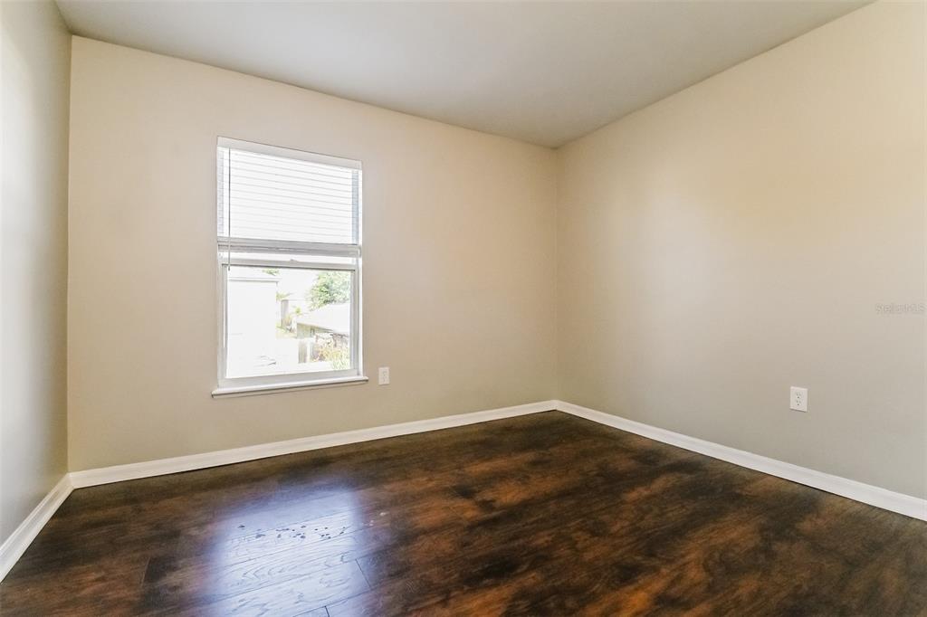 10405 Fly Fishing Street Riverview, FL 33569 - Photo 13 of 15 an empty room with wooden floor and windows