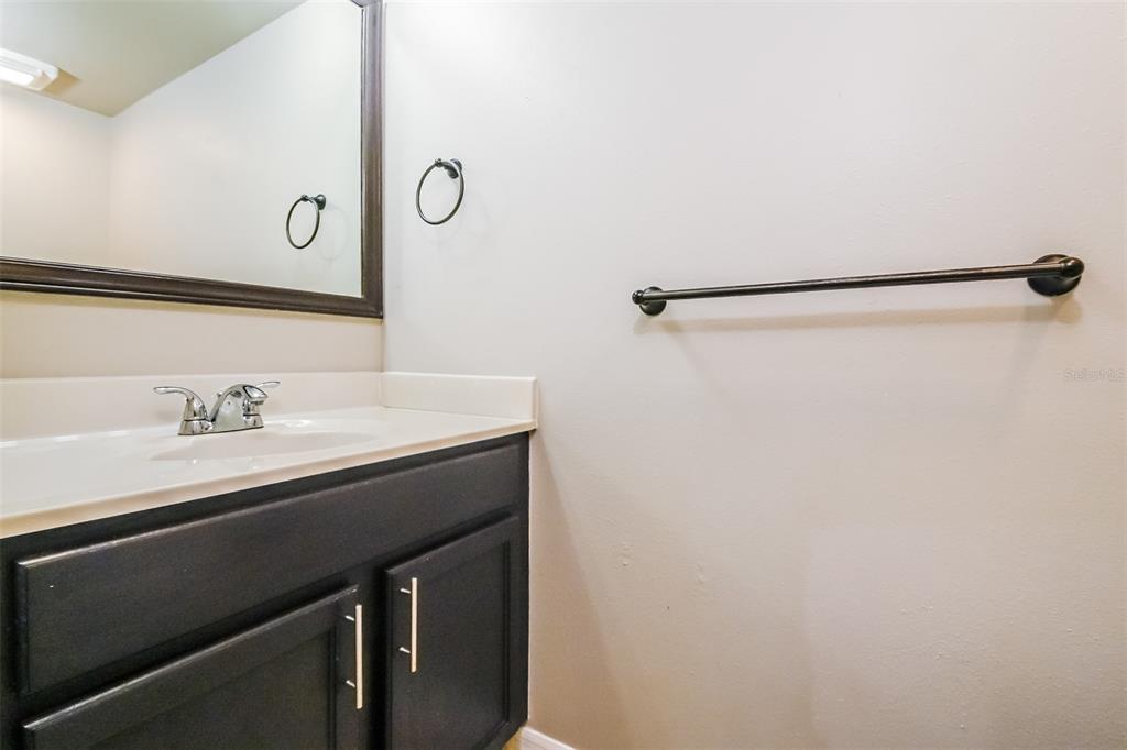 10405 Fly Fishing Street Riverview, FL 33569 - Photo 14 of 15 a bathroom with a sink and a mirror