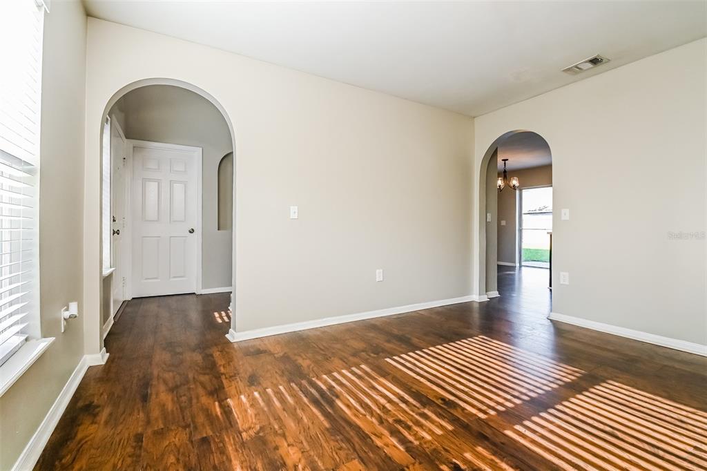 10405 Fly Fishing Street Riverview, FL 33569 - Photo 3 of 15 a view of a livingroom with wooden floor and a window