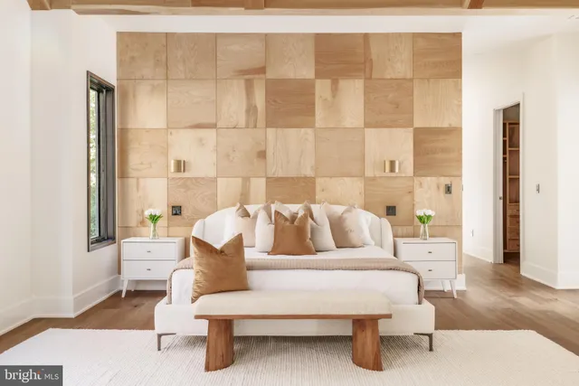 a bathroom with a large tub and sink