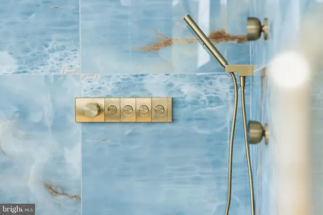 a living room with furniture and floor to ceiling windows