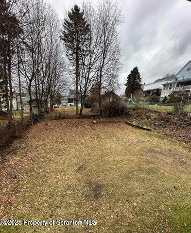 318 15th Avenue, Unit 3 Scranton, PA 18504 - Photo 13 of 13 a view of a yard with a bench and trees