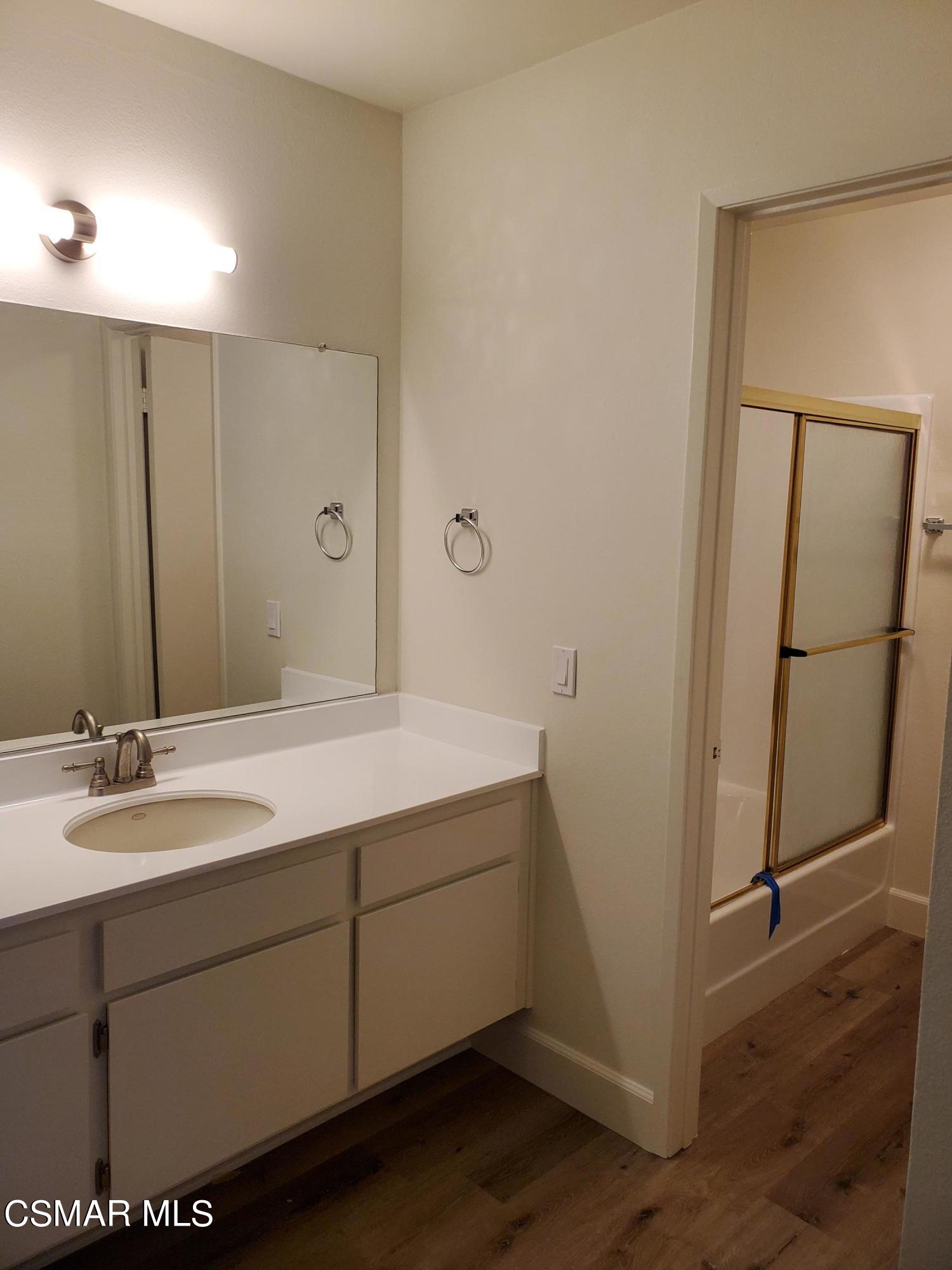 1760 Sinaloa Road, Unit 265 Simi Valley, CA 93065 - Photo 25 of 39 a bathroom with a sink and a mirror