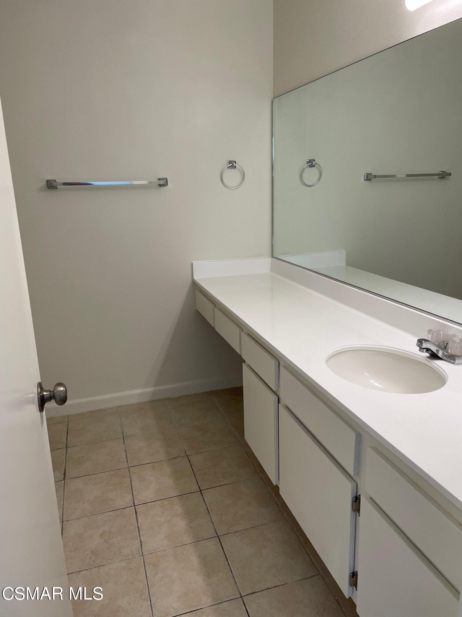 1760 Sinaloa Road, Unit 265 Simi Valley, CA 93065 - Photo 6 of 39 a bathroom with a sink and mirror