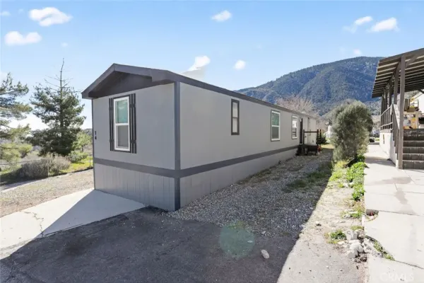 a very nice looking house with a yard