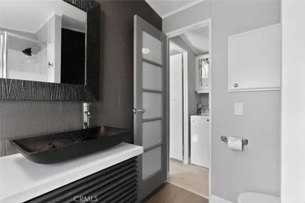 a kitchen with a refrigerator and a stove