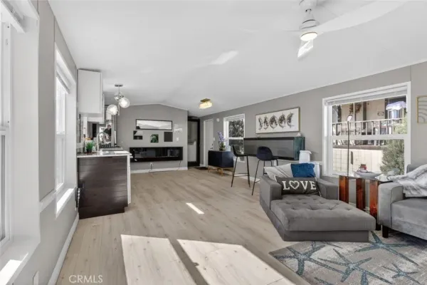 a living room with furniture and a piano