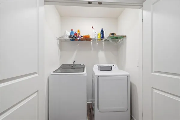 a view of storage and utility room with washer and dryer