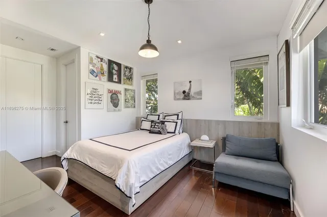 a bedroom with a bed and a couch