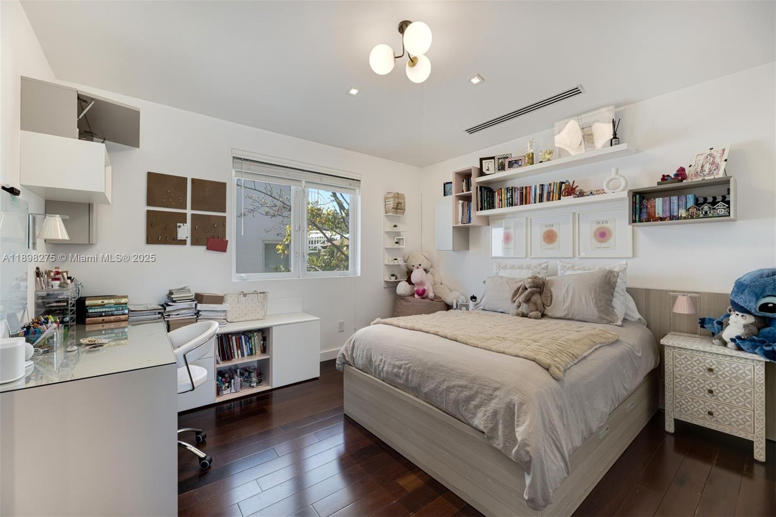 765 Allendale Road Key Biscayne, FL 33149 - Photo 16 of 29 a bedroom with a bed wooden floor and window