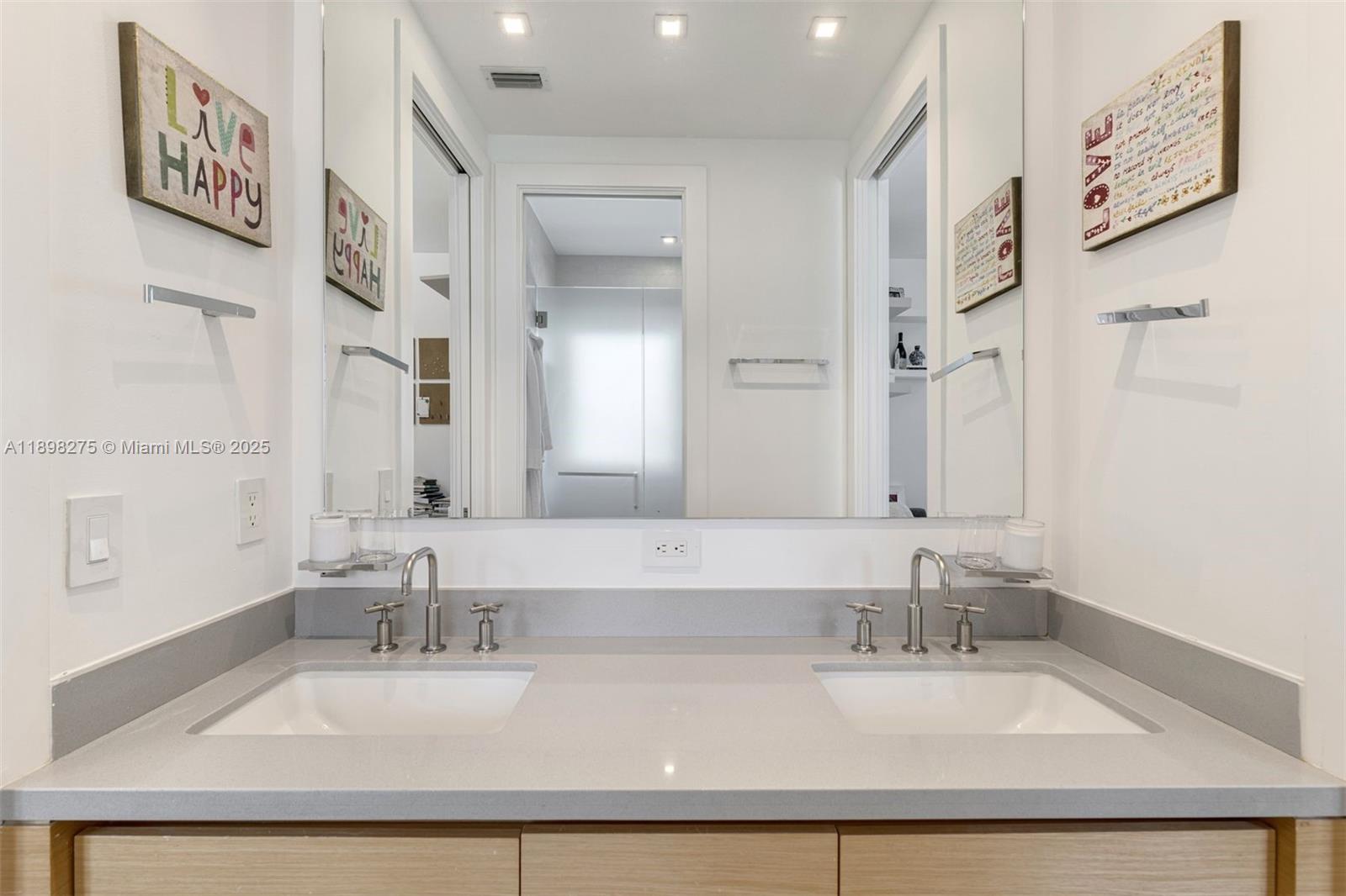 765 Allendale Road Key Biscayne, FL 33149 - Photo 17 of 29 a bathroom with double vanity sinks with a tub