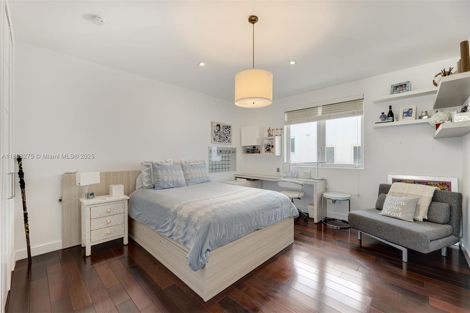 765 Allendale Road Key Biscayne, FL 33149 - Photo 18 of 29 a spacious bedroom with a bed and a chandelier