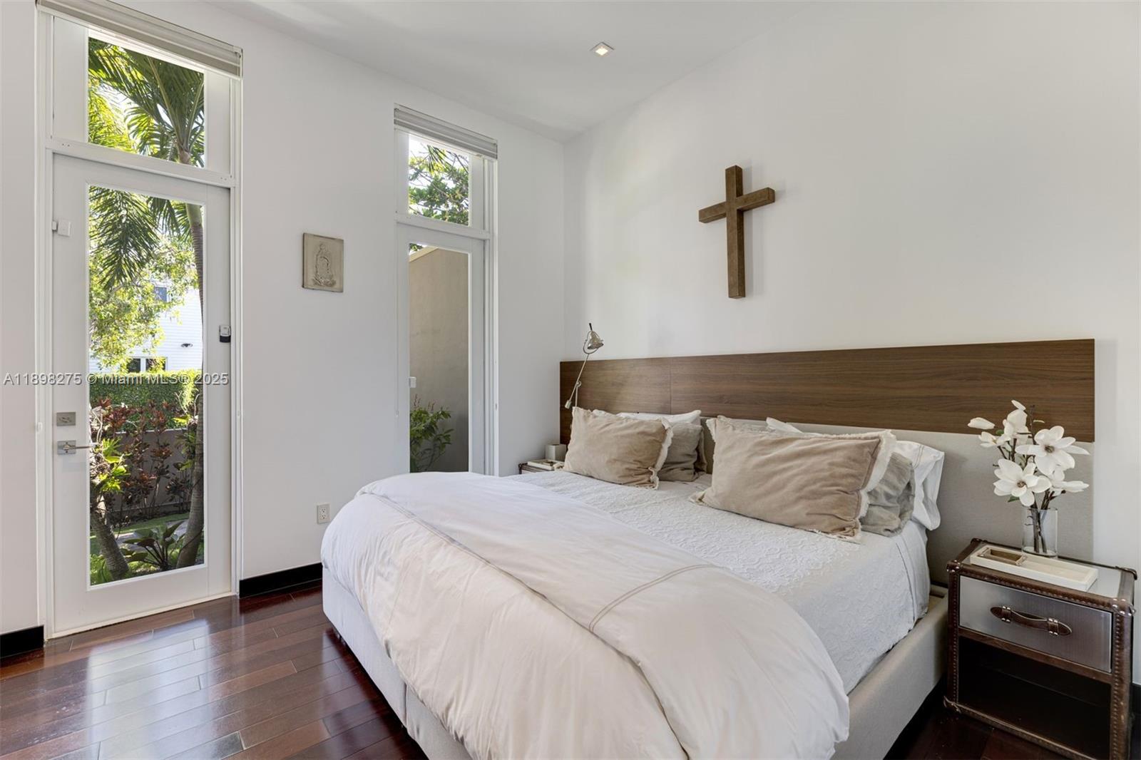 765 Allendale Road Key Biscayne, FL 33149 - Photo 20 of 29 a bedroom with a bed and a window