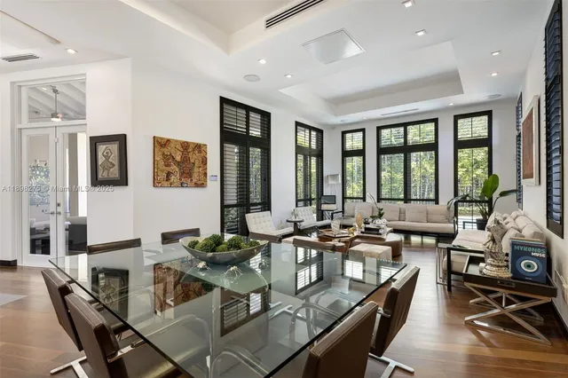 a very nice looking living room with furniture and floor to ceiling windows