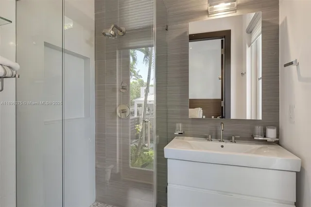 a bathroom with a sink and mirror