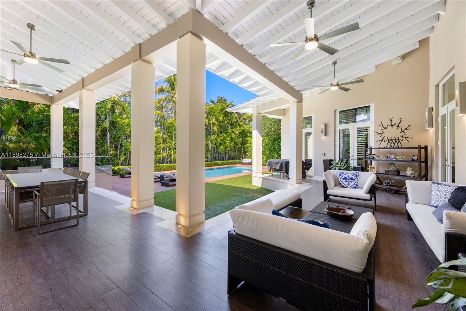 765 Allendale Road Key Biscayne, FL 33149 - Photo 25 of 29 a living room with furniture and a large window